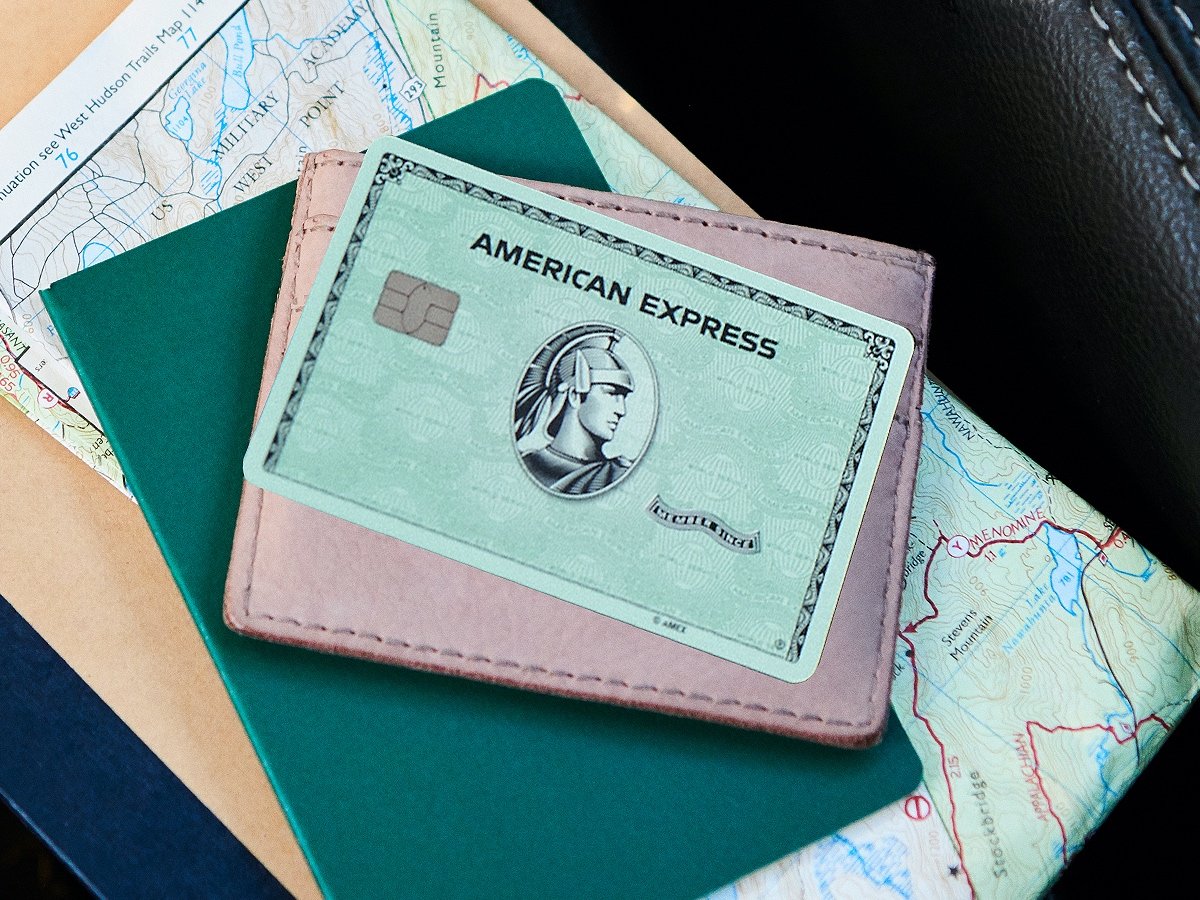 American Express Green Card on a wallet and passport