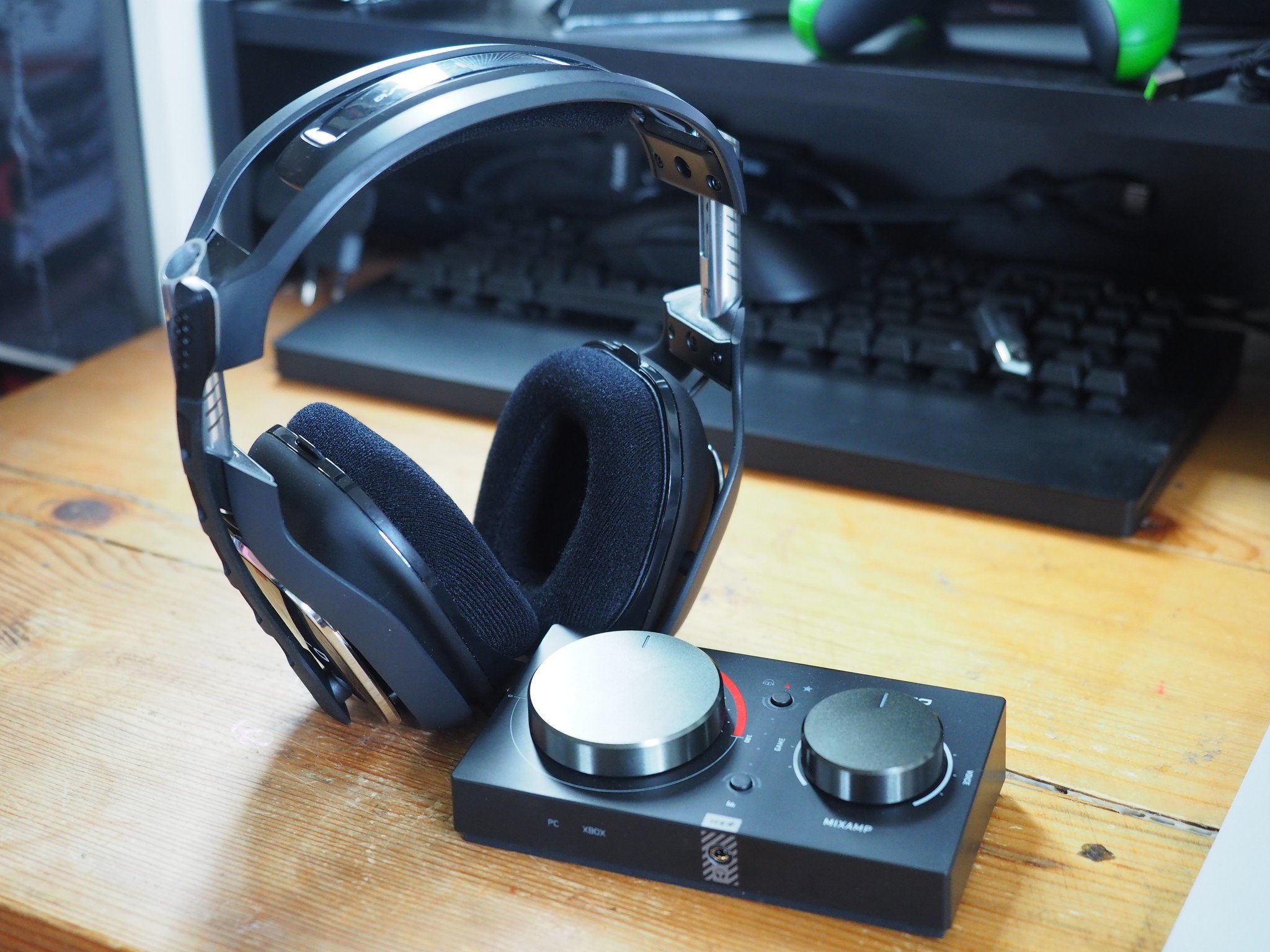 An Astro A40 TR with Mixamp sits on a wooden desk.