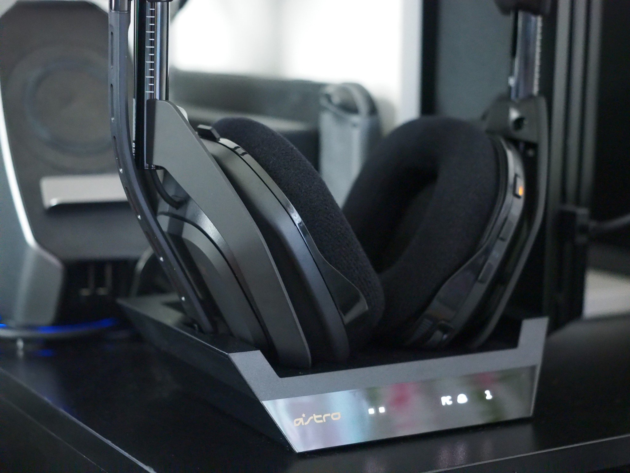 An Astro A50 headset sits in the charging dock. 