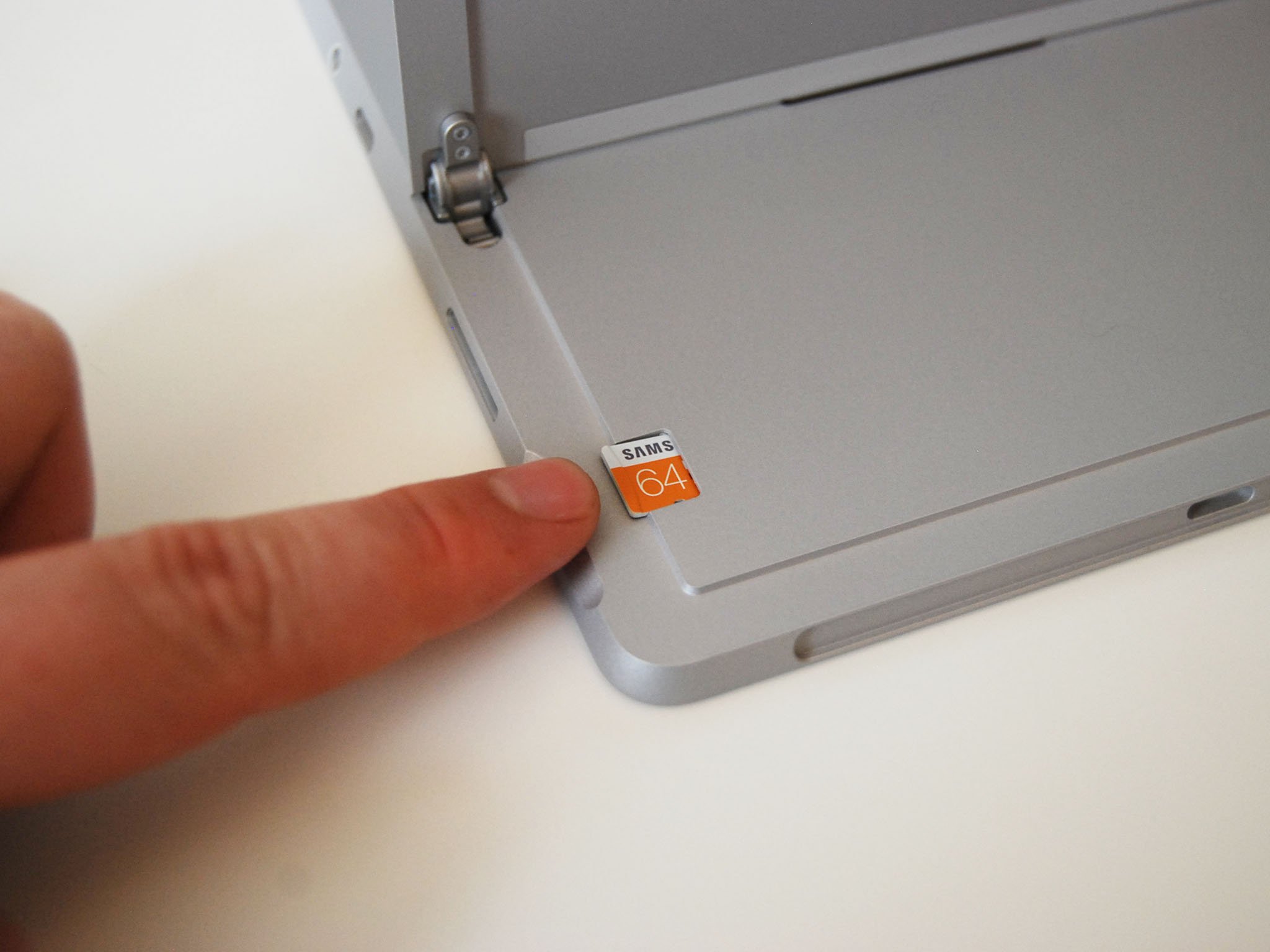 Slide the microSD card into the slot.