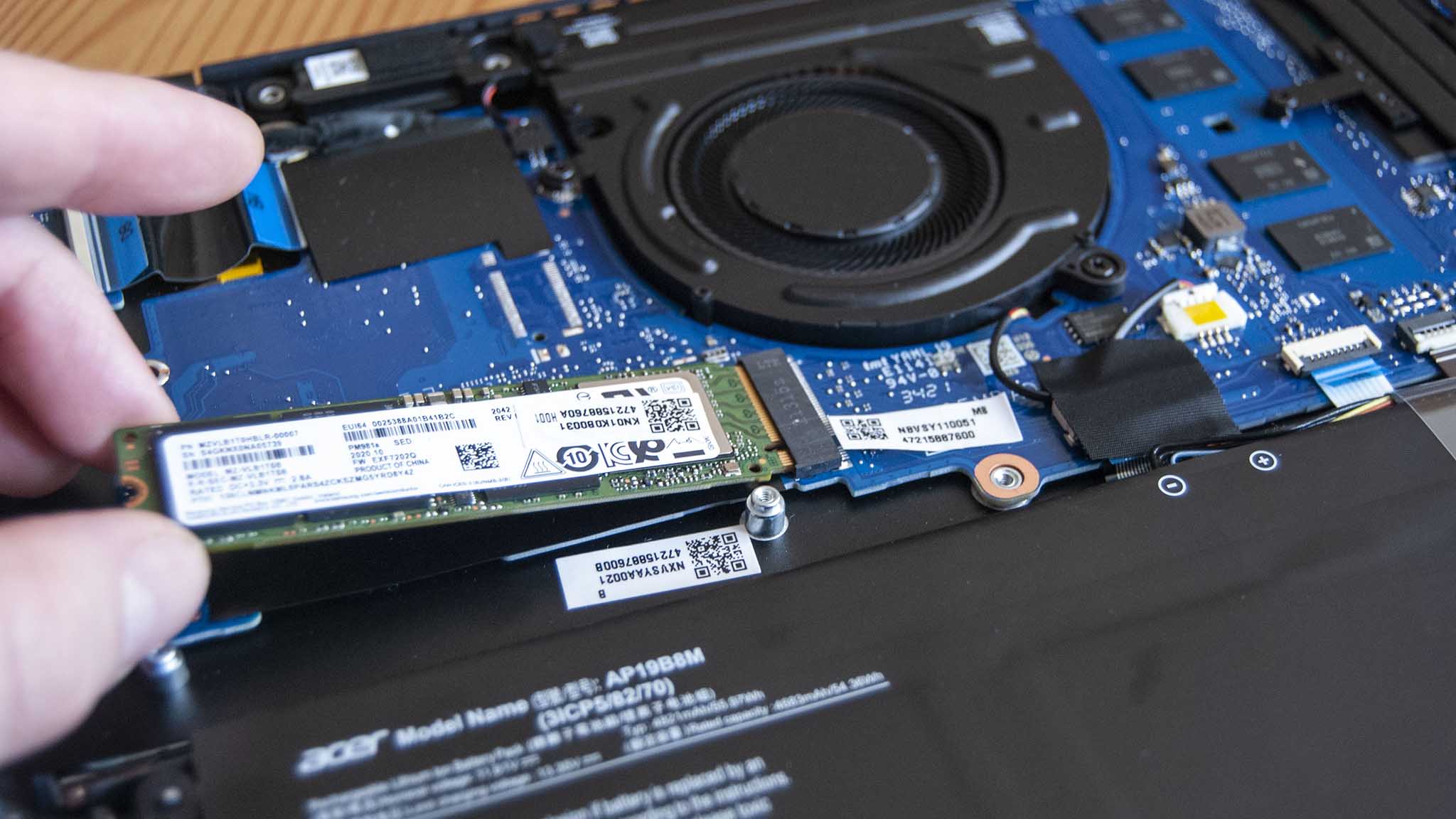 Pull the SSD away from the slot