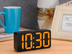 This digital alarm clock charges your phone and drops to $16 with Prime